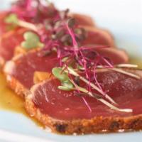 Tuna Tataki · Thin slices grilled rare tuna with spicy ponzu sauce.