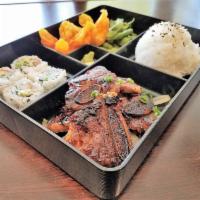 Korean Bbq Galbi Bento · Chef choice sushi roll, appetizer, rice and soup or salad. Comes with choice of protein.