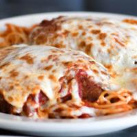 Chicken Parmigiana · Generous portions of fresh chicken cutlets marinated in house, topped with sauce and mozzare...