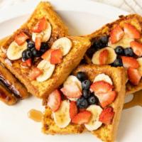 Crunch Nut French Toast (3) · Thick sliced bread dipped in walnuts and cereal then grilled golden brown.