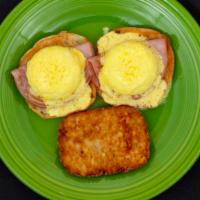 Eggs Benedict · Two poached eggs served on grilled English muffin with Canadian bacon and hollandaise sauce.