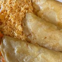 11# Empanadas · Three chicken and cheese patties served with rice, salad, and sour cream.