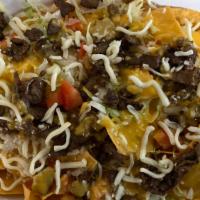 9# Nachos · Tortilla chips covered with melted cheese, mozzarella cheese, lettuce, tomatoes, and your ch...
