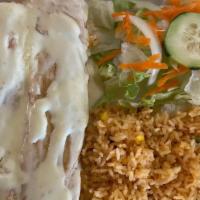 17# Chimichangas · Two fried flour tortillas filled with chicken, covered with cheese dip served with rice and ...