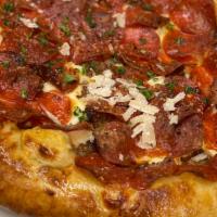 The Mad Mario · Pepperoni, spicy Italian sausage, three cheese blend, our house red sauce, crushed red pepper.