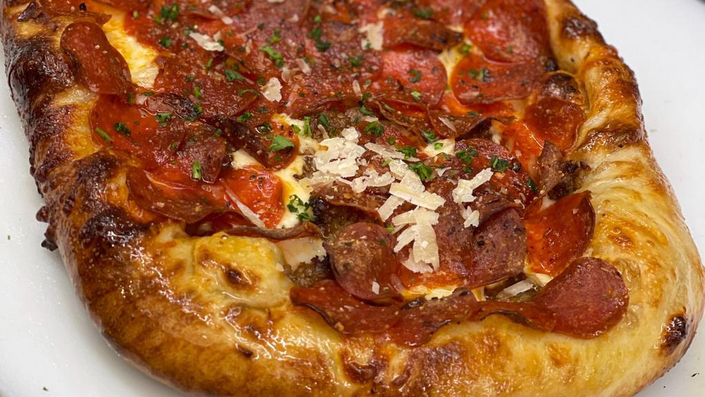The Mad Mario · Pepperoni, spicy Italian sausage, three cheese blend, our house red sauce, crushed red pepper.
