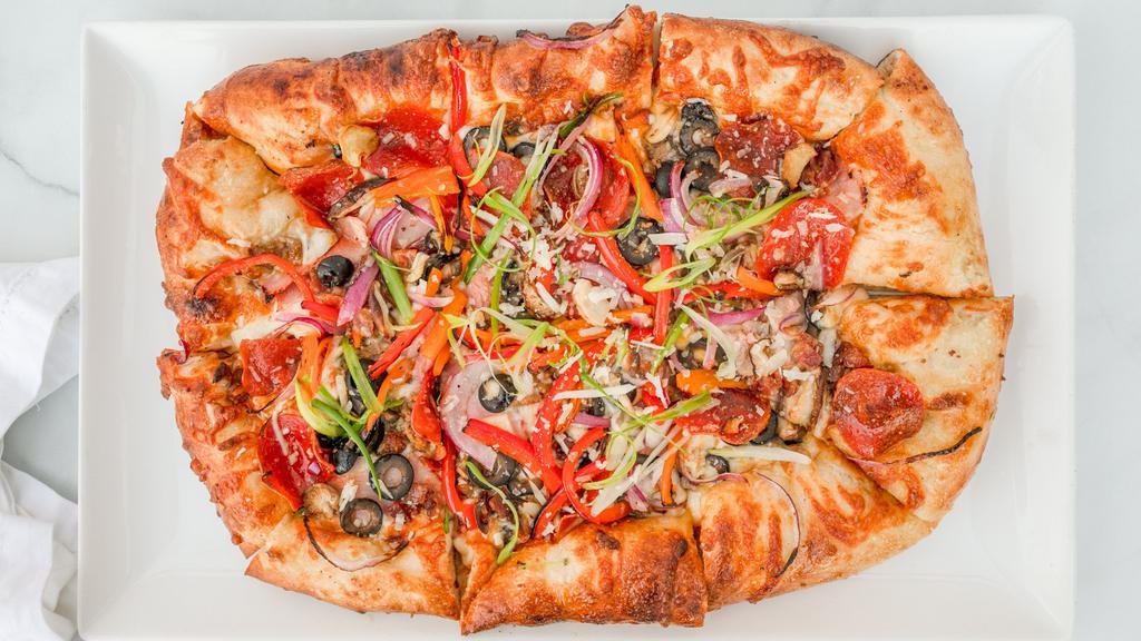The Mega Mix · Ham, pepperoni, spicy Italian sausage, bacon, red onion, diced peppers, wild mushrooms, olives, three cheese blend, and our house red sauce finished with fresh sliced scallion.