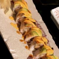 Angry Dragon Roll · Shrimp tempura, spicy tuna, cucumber and spicy king crab with soy bean paper and house golde...