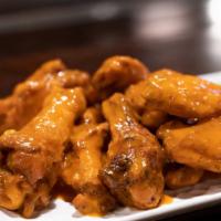 8 Wings · Bone in wings with your choice of flavor.