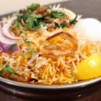 Hyderabadi Chicken Dum Biryani · Savory authentic basmati rice cooked with caramelized onions ginger garlic cardamom turmeric...