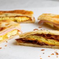 Breakfast Sandwich · Fresh-baked scallion pancake, egg omelet, cheese – with bacon or ham.