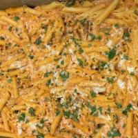 Penne Vodka · Decadent vodka cream sauce over a bed of penne.