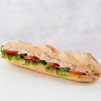 Albacore Tuna Sandwich · Albacore tuna salad, mixed with mayonnaise, lettuce & tomato on a traditional baguette.