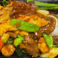 Sp 5. Mandarin Delight · Hot and spicy. Shrimp, beef, chicken sautéed with mixed vegetables in garlic sauce.