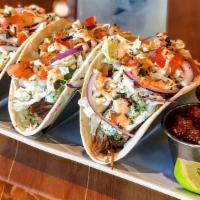 Pulled Pork Tacos · Three huge pulled pork tacos with Napa cabbage slaw, tomato, house salsa and guacamole, sour...