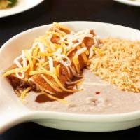 Enchiladas · Two per order. Corn tortilla filled with choice of filling topped with cheese, red chile or ...