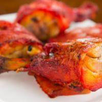 Tandoori Chicken · Tender chicken marinated in fresh yogurt & spices