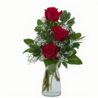 Simply Roses · A simple and beautiful vase filled with three red roses. For a personal message please write...