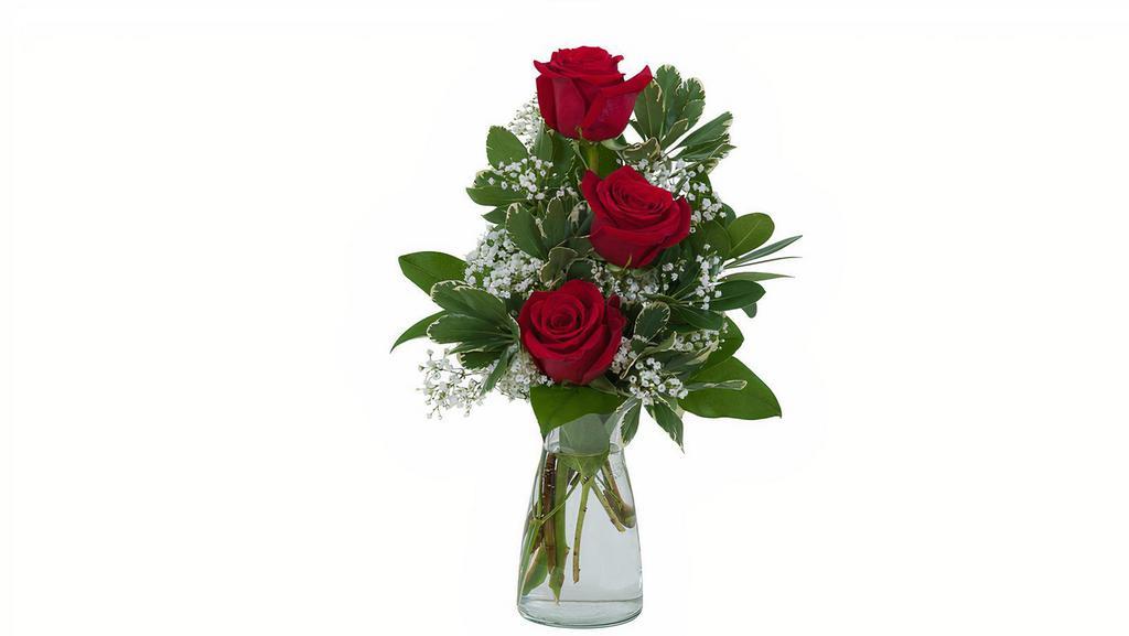 Simply Roses · A simple and beautiful vase filled with three red roses. For a personal message please write in special instructions.