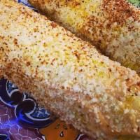 Elote · 1 Fresh yellow corn on the cob with chipotle mayo or regular mayo, imported parmesan cheese ...