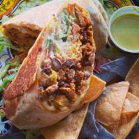 Al Pastor Burrito · lettuce, pico de gallo, chihuahua cheese, sour cream, rice & black beans
