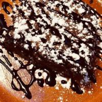 Brownie · Warmed, with chocolate sauce and powdered sugar
