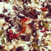 Fajita Pizza · tomato sauce, oaxaca cheese, mozzarella, bacon, grilled steak, fried onions, mushrooms & pep...