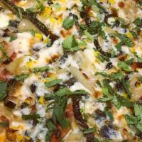 Huitlacoche Pizza · White pizza with corn truffle, mozzarella cheese, fresh garlic, roasted corn, fried onion, p...