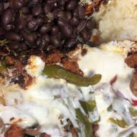Choriqueso · steak, chorizo, oaxaca cheese, fried onions, red & green peppers. served with rice, beans & ...