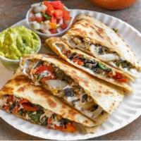 Corn Truffle Quesadillas · (huitaloche) oaxaca cheese, poblano peppers, corn, roasted red pepper & fried onions. choice...