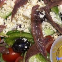 Greek Salad · spring mix, olives, feta, anchovies, red onion, tomato, cucumber, peppers & oregano. choice ...