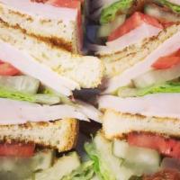 Turkey Club · pickles, lettuce, tomato, bacon, american & mayo on white or wheat toast