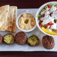 Falafel (4) · Fried patties made from a blend of ground chickpeas and middle eastern spices served with gr...