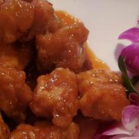General Gau'S Chicken · Served with a choice of egg roll, vegetable spring roll, crab rangoon, or chicken wings. Cho...