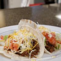 Beef Tacos  · Slow cooked ground beef in mexican spices, bell peppers and onions.