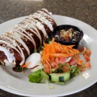 Famous Wet Burrito · Your choice of chicken or beef, topped with traditional mole sauce, mexican sour cream and q...