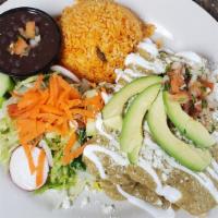Avocado House Enchiladas · Corn tortilla stuffed with cheese and your choice of crab meat or shrimp. Wet with mexican c...