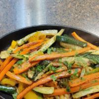 Veggie Fajita · Grilled veggies (carrots, zucchini and yellow squash), over a bed of onions and peppers. wit...