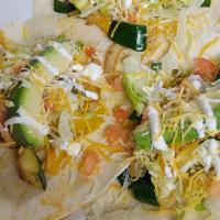 Veggie Tacos · Grilled zucchini and yellow squash with onions, peppers and tomatoes. Served flour tortilla ...