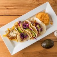 Tacos: Camarón Tequila · Grilled shrimp in our tamarind & tequila marinade, pico de gallo, citrus cabbage, and avocado.