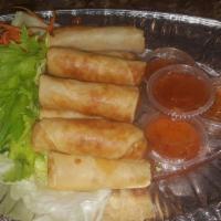 Crispy Spring Roll (3) · Chicken and vegetable wrapped in rice pancake served with a sweet Thai chili sauce.