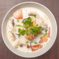 Coconut Soup (Tom Kah) · Fresh coconut broth with lemongrass, galangal, kaffir lime leaf, tomatoes, onion, fresh mush...