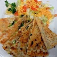 Quesadilla · Tender perfectly seasoned chicken breast, sauteed bell peppers, onions melted cheddar cheese...
