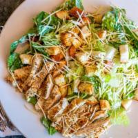 Grilled Chicken Caesar · Romaine tossed in a creamy Caesar dressing with croutons and Romano cheese.