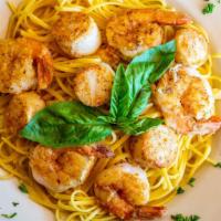 Shrimp Scampi · Fresh gulf shrimp seasoned with lemon butter and garlic, with a touch of white wine over lin...