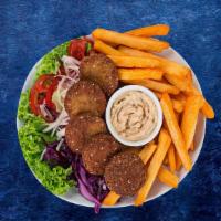 Falafel Frenzy Plate · Four balls of fried chickpeas seasoned with middle eastern spices on a bed of Egyptian salad...