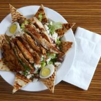 Greek Salad · Top menu item. Chopped greens, Kalamata olives, feta cheese, red onions, anchovies, cucumber...