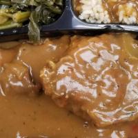 Smothered Turkey Chops Over Rice · Smothered Turkey Chops over rice, served with 2 sides & a roll