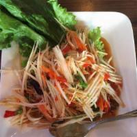 Papaya Salad · Julienned green papaya, roasted ground peanut, green bean and tomatoes tossed in a Thai lime...