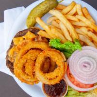 Jack Onion Ring Burger (8 Oz) · Burger with cheddar cheese bacon and onion rings served with a side of Jack Daniels bbq sauce.